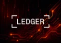 Ledger logo overlaid on a dark red circuit board background representing the fake Ledger Live app on Apple's App Store that stole $9.5 million from cryptocurrency users in April 2026