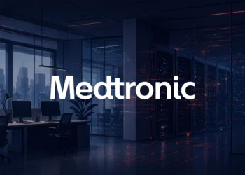 Illustrative corporate IT office with workstations and a glass-enclosed server room, featuring subtle red digital data flows across a dark, modern environment, with Medtronic logo displayed in the center.